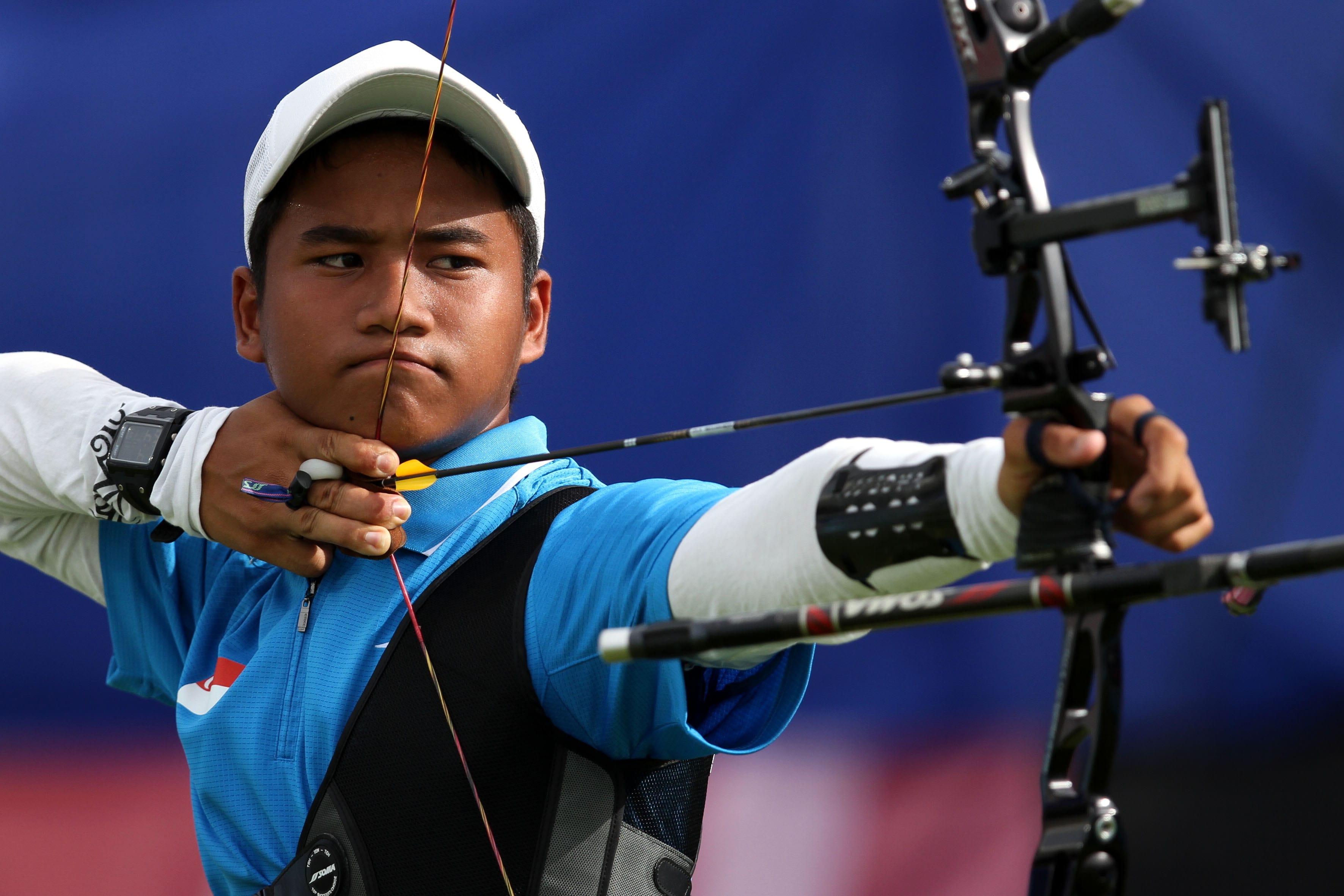 Abdud Dayyan bin Mohamed Jaffar in action during the mixed team bronze medal archery match against Spain. The Straits Times/The New Paper © Singapore Press Holdings Ltd. Reprinted with permission.